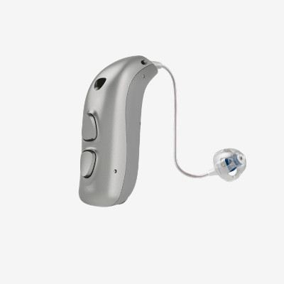 A modern, silver behind-the-ear hearing aid with two buttons and a clear tube leading to a small earbud with a blue accent, shown on a white background.